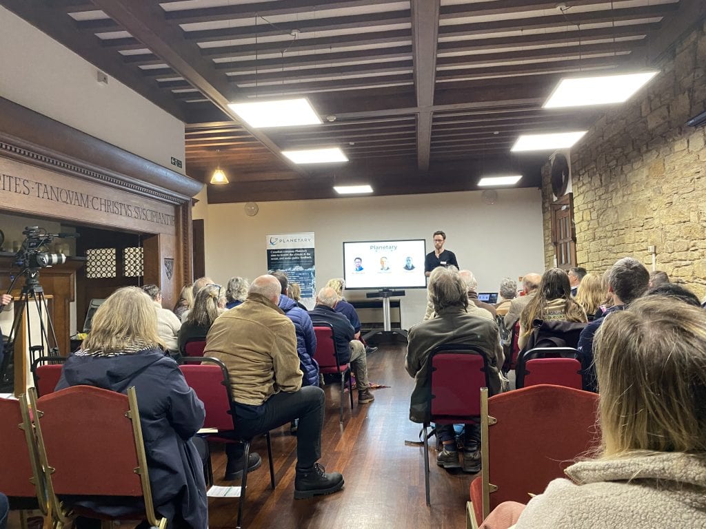 Dr Will Burt, Chief Ocean Scientist at Planetary, presents the science behind ocean alkalinity enhancement to an audience of interested members of the public who live near the proposed site of deployment.